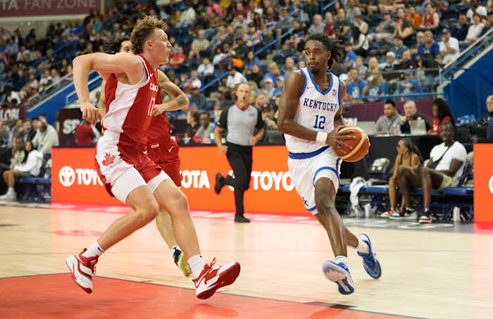 Jul 16, 2023; Toronto, Ontario, Canada; USA-Kentucky guard Antonio Reeves (12) drives to the net against Canada forward Adam Paige (17) during the first half of the Men's Gold game at Mattamy Athletic Centre. Mandatory Credit: John E. Sokolowski-USA TODAY Sports